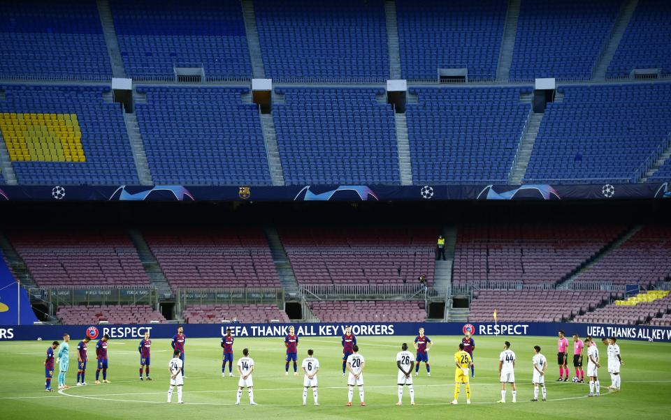 Players observe a moments silence before the Champions League round of 16, second leg soccer match between Barcelona and Napoli at the Camp Nou Stadium in Barcelona, Spain, Saturday, Aug. 8, 2020. (AP Photo/Joan Monfort)