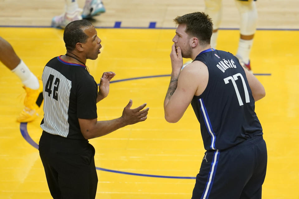 Dallas Mavericks guard Luka Doncic (77) reacts toward referee Eric Lewis after being called for a foul against the Golden State Warriors during the first half of Game 2 of the NBA basketball playoffs Western Conference finals in San Francisco, Friday, May 20, 2022. (AP Photo/Jeff Chiu)
