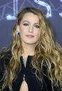 <p> Blake Lively's loose, undone and beachy waves, worn here in a half up hairstyle, have a kind of boho '70s feel to them. Either a curling wand or heatless curl methods can work really well for creating this kind of look. </p>