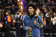 Illinois' Andre Curbelo dances while in street clothes before an NCAA college basketball game against Notre Dame Monday, Nov. 29, 2021, in Champaign, Ill. (AP Photo/Michael Allio)