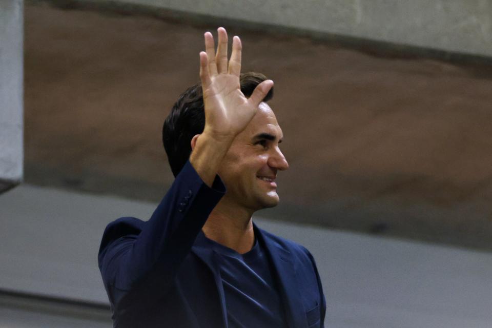 Tennis great Roger Federer waves to the crowd during the quarterfinal match between Aryna Sabalenka, of Belarus, and Zheng Qinwen, of China, during the U.S. Open tennis championships, Tuesday, Sept. 3, 2024, in New York. (AP Photo/Adam Hunger) (AP)