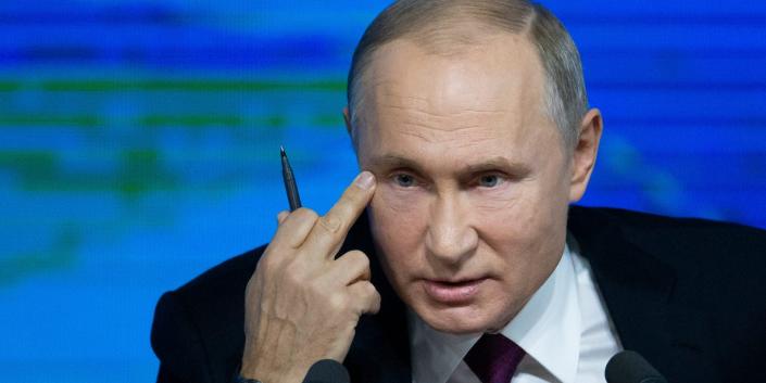 Vladimir Putin with his middle finger near his eye