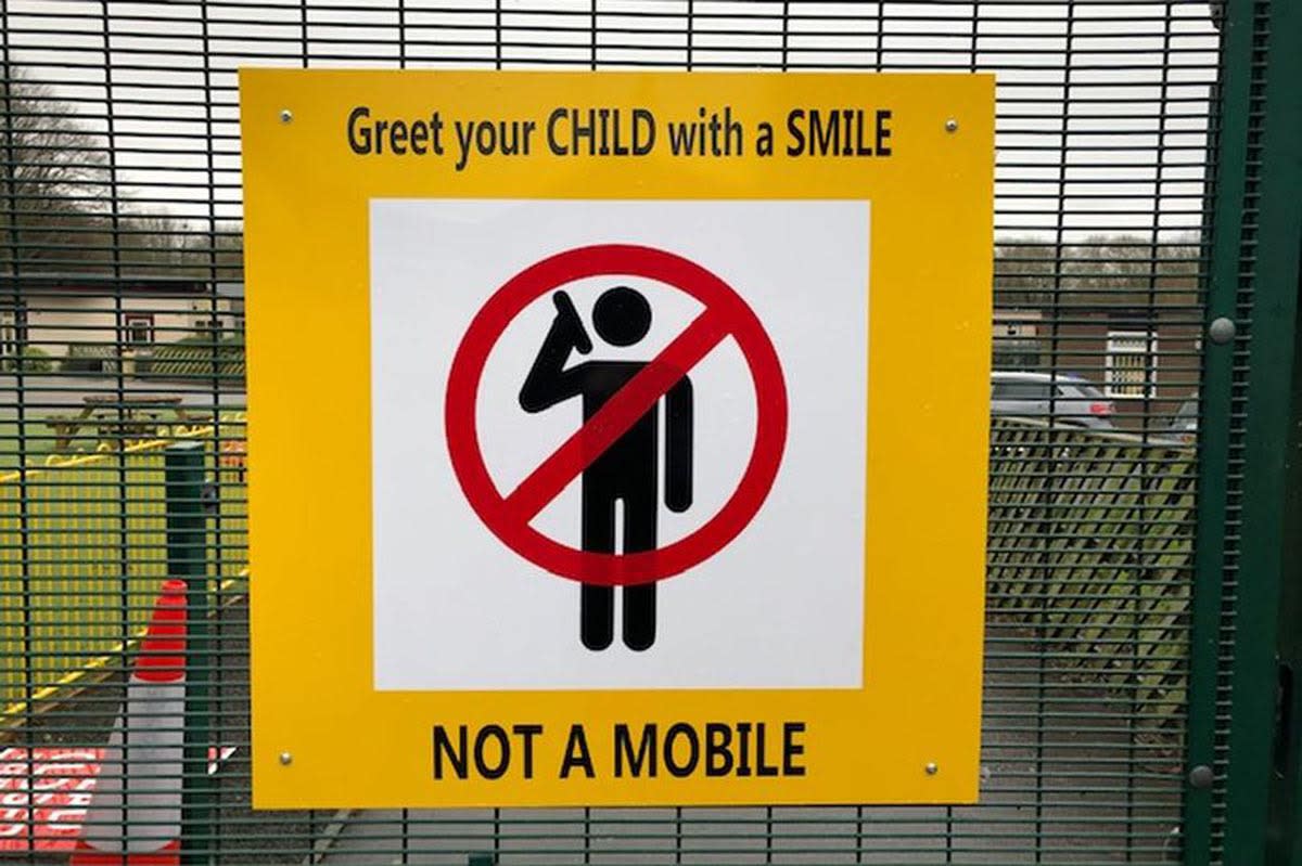 The sign was placed outside Redwood Road school in Derby (Picture: Reach)