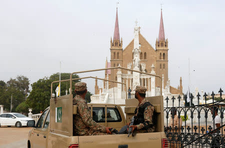 Soldiers sitting in a vehicle are seen during their arrival ahead of the funeral ceremony of the German born nun Ruth Pfau, at the St. Patrick's Cathedral in Karachi, Pakistan August 18, 2017. REUTERS/Akhtar Soomro