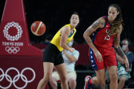 United States's Brittney Griner (15) runs down a loose ball ahead of Australia's Jenna O'Hea, left, during a women's basketball quarterfinal round game at the 2020 Summer Olympics, Wednesday, Aug. 4, 2021, in Saitama, Japan. (AP Photo/Charlie Neibergall)