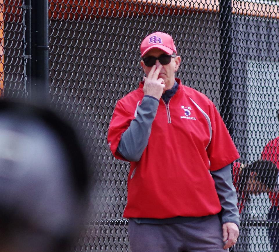 Bridgewater-Raynham softball coach Mike Carroza sends in pitch signals to his catcher during a scrimmage against Middleboro on Monday, March 23, 2023.