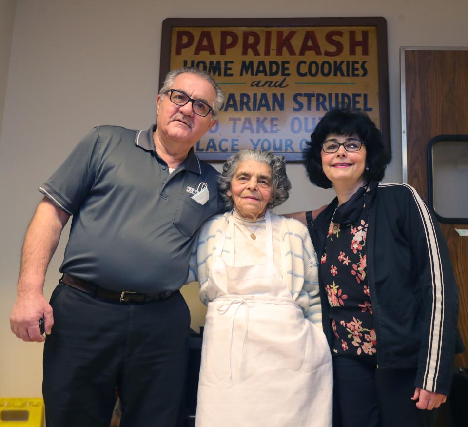 Milos “Mitch” Lekic stands with his mother-in-law, Lucija "Lou” Strebick, and his wife, Mary Lou Lekic, in 2021 at the New Era in Akron.