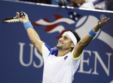 David Ferrer of Spain celebrates match point in defeating Janko Tipsarevic of Serbia at the U.S. Open tennis championships in New York, September 2, 2013. REUTERS/Eduardo Munoz