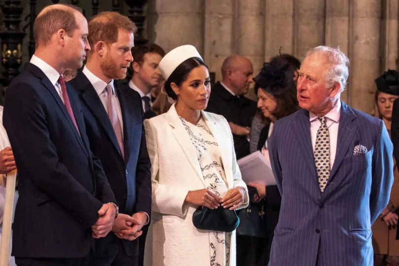 Britain's Meghan, Duchess of Sussex (2R) talks with Britain's Prince Charles, Prince of Wales