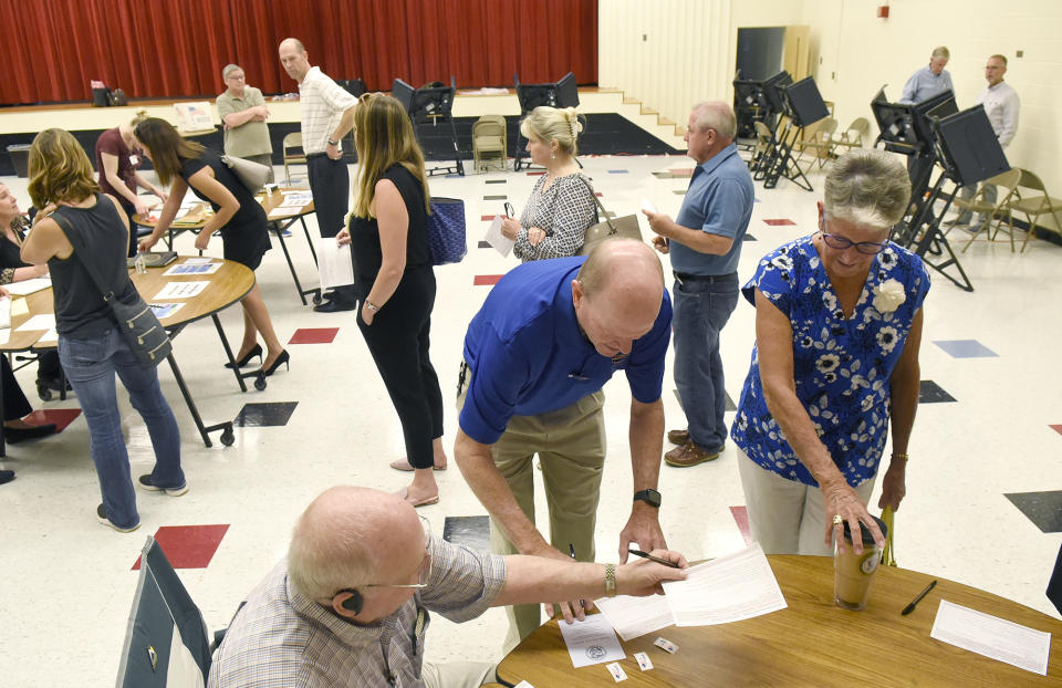 Precinct #74, at Alexander Graham Middle School, experienced a flurry of voters Tuesday, September 10, 2019 as they cast their ballots in the party primaries and in the 9th District race between Dan Bishop and Dan McCready. Voters across Charlotte and the region went to the polls to vote in local Democrat and Republican primaries, while others, in the now infamous 9th District, voted to send either Dan McCready or Dan Bishop to represent them in Congress on Tuesday, Sept. 10, 2019. (John D. Simmons/The Charlotte Observer via AP)