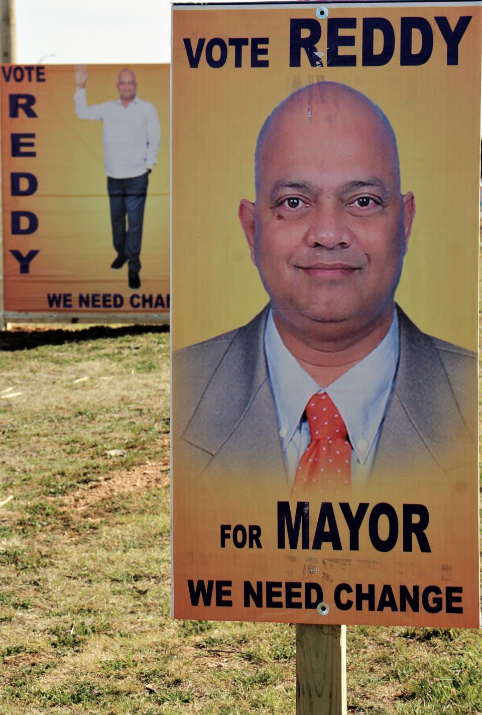 Campaign signs posed for Dasi Reddy, who announced for mayor of Abilene this week.