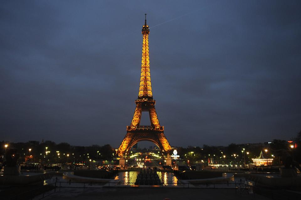 The Eiffel Tower, lit up against the night sky