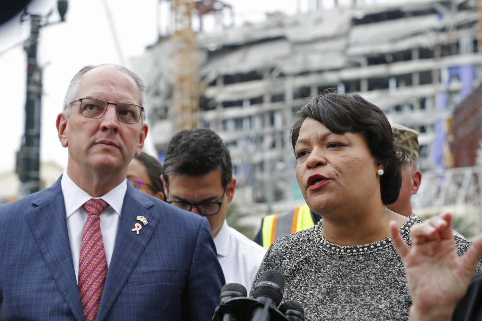 New Orleans Mayor Latoya Cantrell and Louisiana Gov. John Bel Edwards address reporters near the Hard Rock Hotel, Thursday, Oct. 17, 2019, in New Orleans. The 18-story hotel project that was under construction collapsed last Saturday, killing three workers. Two bodies remain in the wreckage. (AP Photo/Gerald Herbert)
