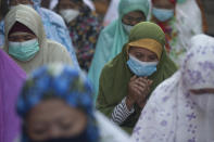 Muslim women pray during the Eid al-Fitr celebration in Bali, Indonesia on Thursday, May 13, 2021. Indonesian Muslims perform Eid al-Fitr prayer that marks the end of the holy fasting month of Ramadan. (AP Photo/Firdia Lisnawati)