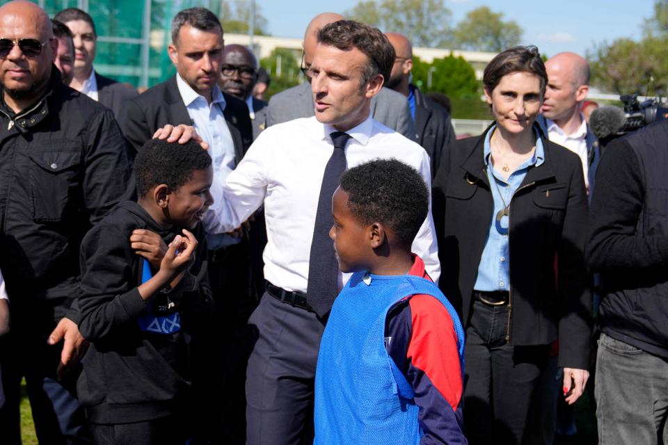 Macron greets youth at the Auguste Delaune stadium in Saint Denis (POOL/AFP/Getty)