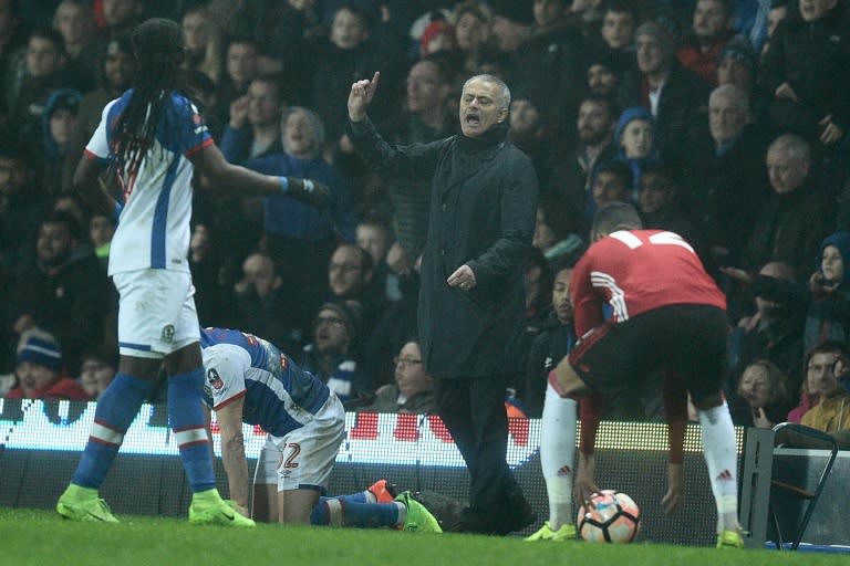 Manchester United's manager Jose Mourinho (C) reacts on the touchline during an English FA Cup fifth round football match against Blackburn Rovers on February 19, 2017