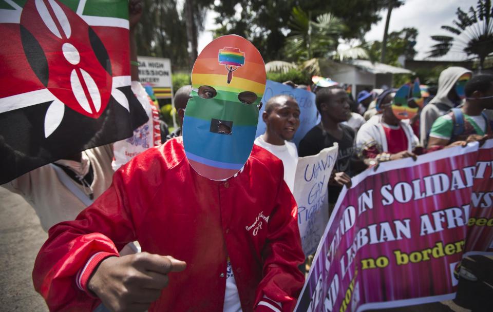 Kenyan gays and lesbians and others supporting their cause wear masks to preserve their anonymity as they stage a rare protest, against Uganda's increasingly tough stance against homosexuality and in solidarity with their counterparts there, outside the Uganda High Commission in Nairobi, Kenya Monday, Feb. 10, 2014. Homosexuality has been criminalized in Uganda where lawmakers have recently passed a new bill, which appears to have wide support among Ugandans, that prescribes life imprisonment for "aggravated" homosexual acts. (AP Photo/Ben Curtis)