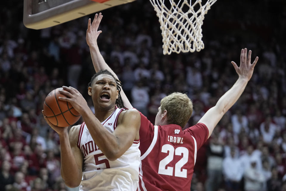 Indiana's Malik Reneau (5) puts up a shot against Wisconsin's Steven Crowl (22) during the second half of an NCAA college basketball game, Saturday, Jan. 14, 2023, in Bloomington, Ind. (AP Photo/Darron Cummings)