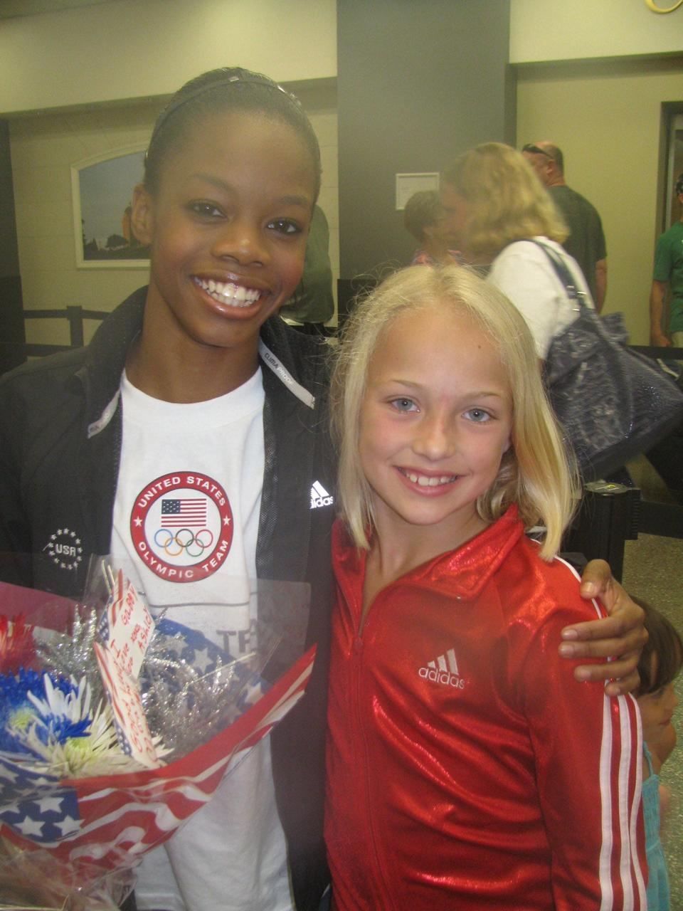 Future Drake basketball star Katie Dinnebier, right, is pictured with Olympic gymnast Gabby Douglas, who also trained at Chow’s Gymnastics & Dance Institute in West Des Moines.