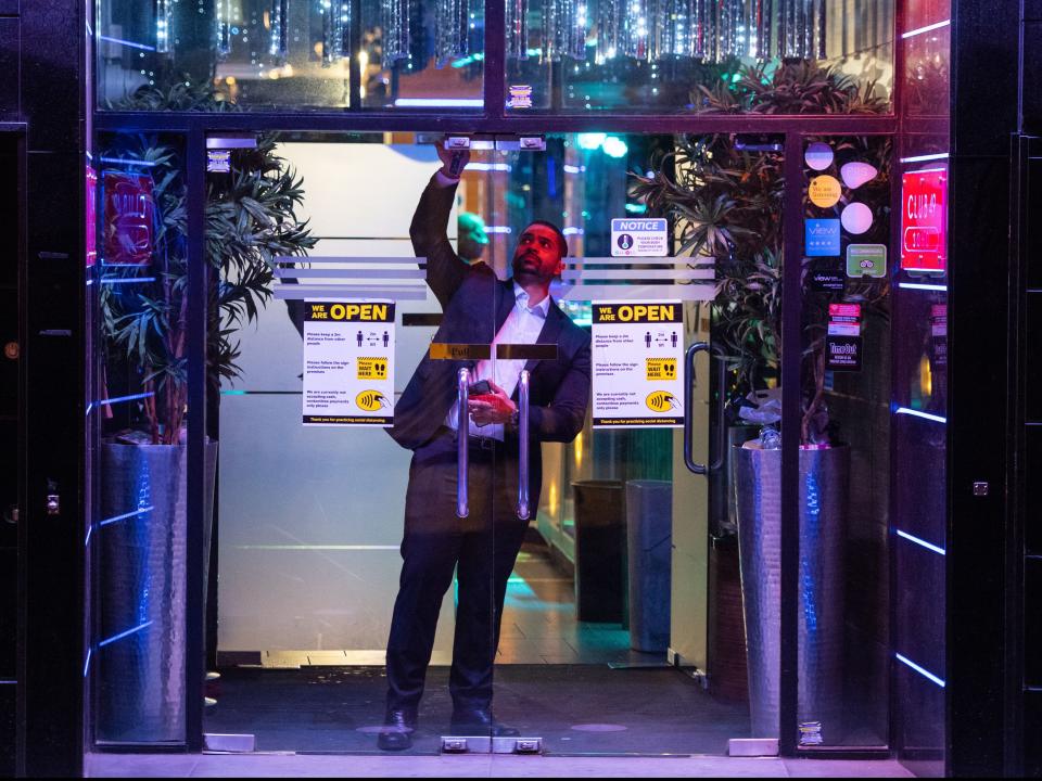 A bar shuts its doors at the 10pm closing time in Soho, London. (PA)