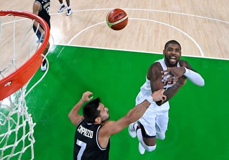 Aug 17, 2016; Rio de Janeiro, Brazil; USA guard Kyrie Irving (10) loses control of the ball against Argentina point guard Facundo Campazzo (7) during the men's basketball quarterfinals in the Rio 2016 Summer Olympic Games at Carioca Arena 1. Mandatory Credit: USA TODAY Sports