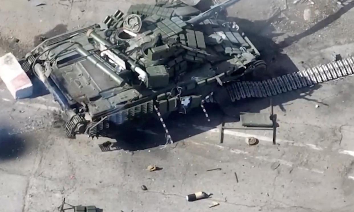 <span>Footage released by the Russian defence ministry shows what it says is a destroyed tank used by pro-Ukrainian fighters, at the Russian-Ukrainian border.</span><span>Photograph: Russian defence ministry press service/Reuters</span>