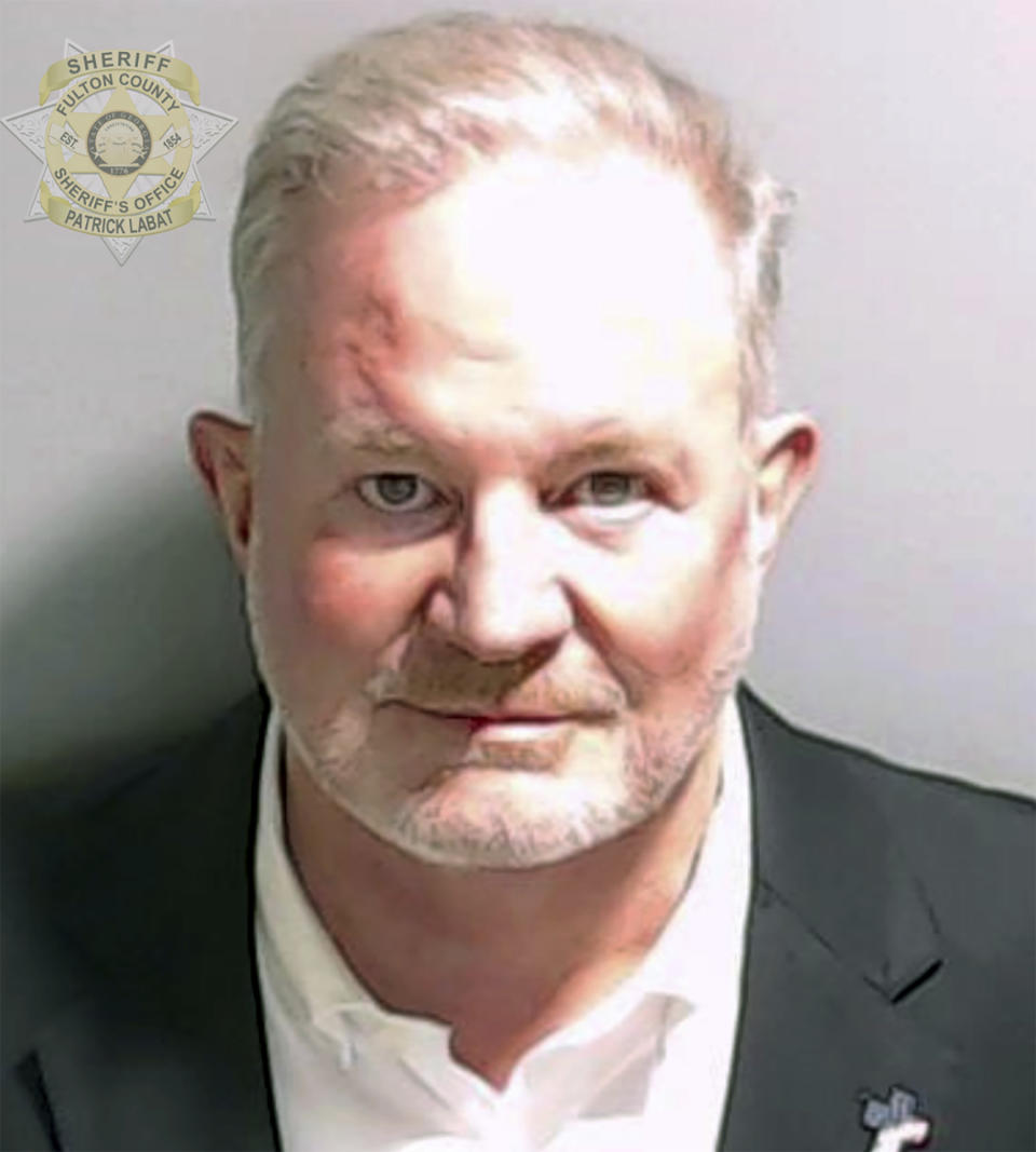 FILE - This booking photo provided by the Fulton County Sheriff's Office shows Scott Hall on Tuesday, Aug. 22, 2023. A bail bondsman charged alongside former President Donald Trump and 17 others in the Georgia election interference case pleaded guilty to misdemeanor charges on Friday, Sept. 29, becoming the first defendant to accept a plea deal with prosecutors. As part of the deal, Scott Graham Hall will receive five years of probation and agreed to testify in further proceedings. (Fulton County Sheriff's Office via AP, File)