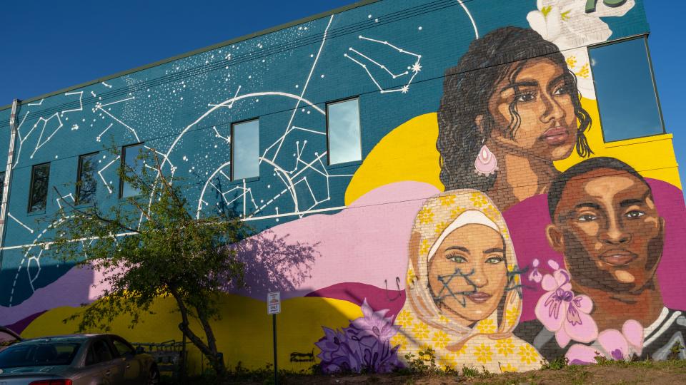 A new mural, "Home Is Where We Make It," was installed less than 48 hours before it was defaced twice on April 30, and residents are outraged.