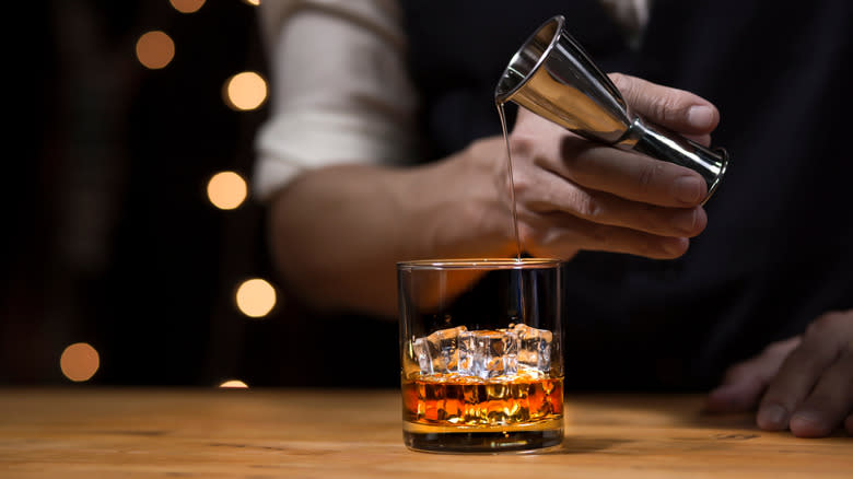 bartender serving bourbon
