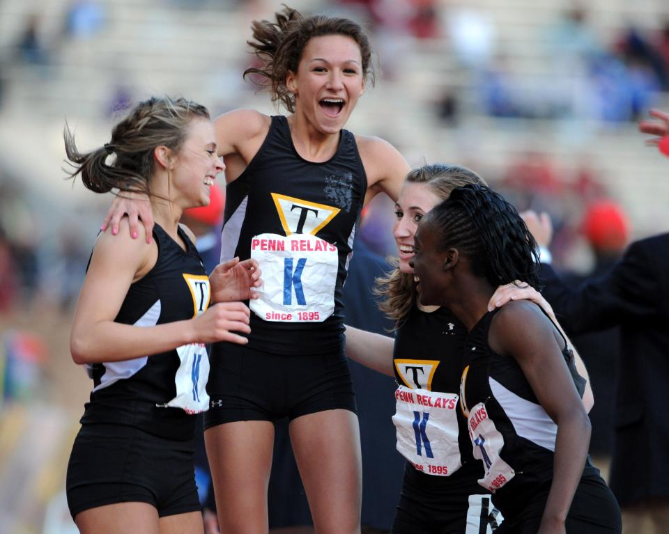 Members of the Tatnall girls distance medley relay celebrate after their victory in the Championship of America race in the 115th Penn Relays at Franklin Field at the University of Pennsylvania in 2009.