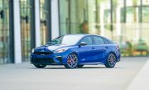 <p>Adding to the Forte GT's presence on the road are a number of visual tweaks including a body kit, a rear spoiler, a black grille, and two-tone wheels.</p>