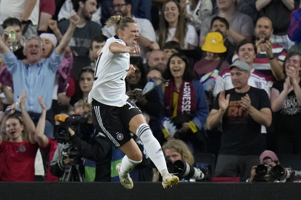 Germany's Alexandra Popp celebrates after scoring the opening goal during the Women Euro 2022 semifinal soccer match between Germany and France at Stadium MK in Milton Keynes, England, Wednesday, July 27, 2022. (AP Photo/Alessandra Tarantino)