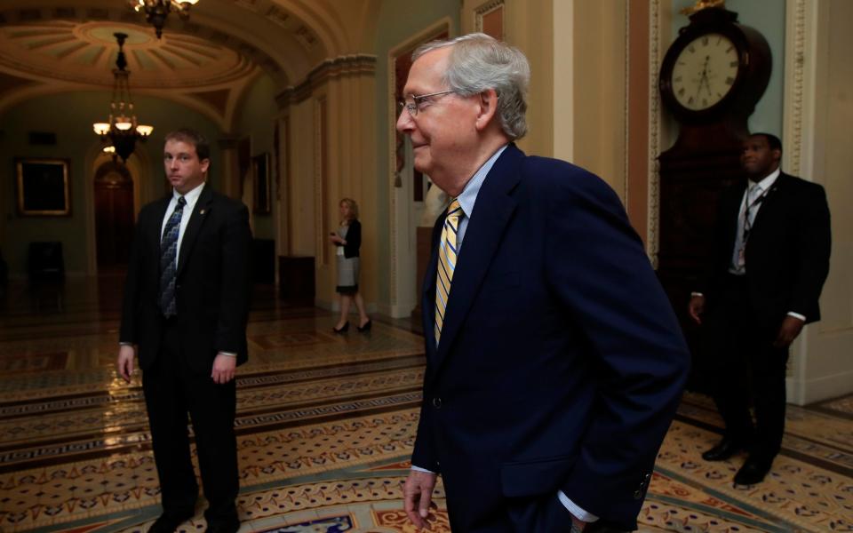 Senate Majority Leader Mitch McConnell, walks towards the Senate floor on Capitol Hill in Washington - Credit: AP