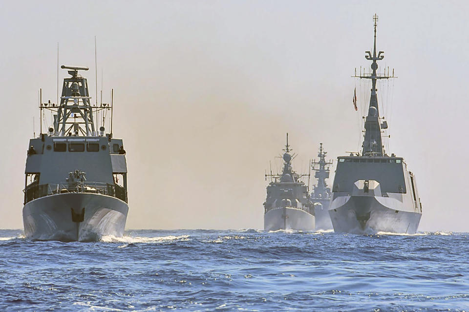 In this photo provided on Monday, Aug. 31, 2020, by the Greek Defense Ministry, warships from Greece, Italy, Cyprus and France, participate in a joint military exercise which was held from 26-28 of August, south of Turkey in eastern Mediterranean sea. Turkey on Monday, Aug. 31, accused Greece of "piracy" and warned it will stand up to Athens' alleged efforts to militarize islands near its coast.(Greek Defense Ministry via AP)