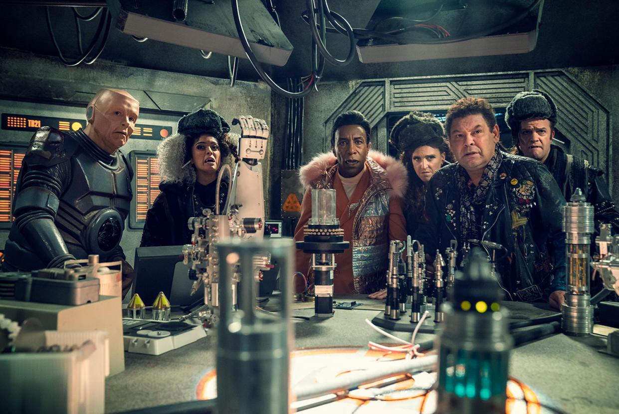 Robert Llewellyn as Kryten, Mandeep Dhillon as Sister Luna, Danny John-Jules as The Cat, Lucy Pearman as Sister Peanut, Craig Charles as Lister, Tom Bennett as Brother Sol in Red Dwarf: The Promised Land. (UKTV)
