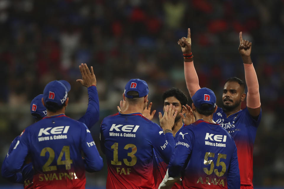 Royal Challengers Bengaluru's players celebrates the dismissal of Delhi Capitals' Axar Patel during the Indian Premier League cricket match between Royal Challengers Bengaluru and Delhi Capitals in Bengaluru, India, Sunday, May 12 , 2024. (AP Photo/Kashif Masood)