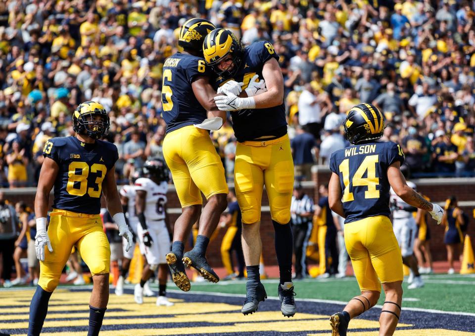 Michigan wide receiver Cornelius Johnson (6) celebrates his touchdown with tight end Joel Honigford (84) s during the first half at Michigan Stadium in Ann Arbor on Saturday, Sept. 18, 2021.