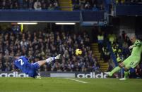 Chelsea's Branislav Ivanovich (L) challenges West Bromwich Albion's goalkeeper Boaz Myhill during their English Premier League soccer match at Stamford Bridge in London November 9, 2013.