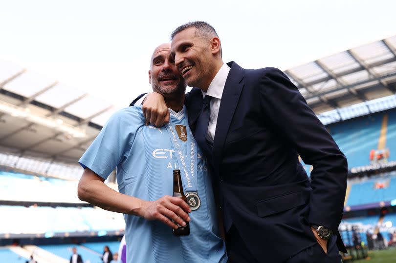 Pep Guardiola celebrates Manchester City's Premier League title win