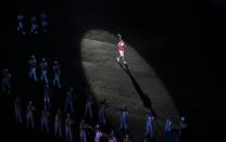 A torch bearer runs with the Youth Olympic torch during the 2014 Nanjing Youth Olympic Games opening ceremony, in Nanjing, Jiangsu province, August 16, 2014. REUTERS/Aly Song