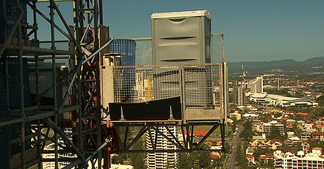 The 'loo with a view' sits on scaffolding on the edge of the Surfers Aquarias.