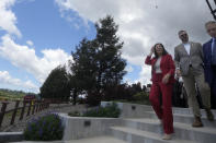 Acting United States Secretary of Labor Julie Su, third from right, walks after speaking at a news conference at Balletto Vineyards in Santa Rosa, Calif., Friday, April 26, 2024. Temporary farmworkers workers are getting more legal protections against employer retaliation, unsafe working conditions, illegal recruitment and other abuses. The rule announced Friday by the Biden administration aims to bolster support workers on H-2A visas. (AP Photo/Jeff Chiu)