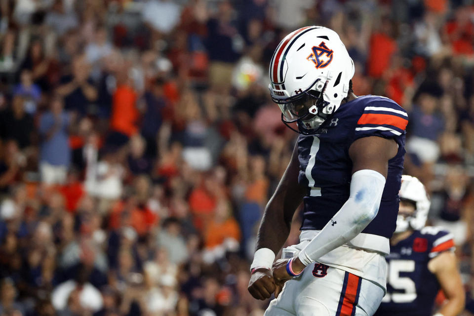 Auburn quarterback T.J. Finley (1) reacts after scoring a touchdown against San Jose State during the second half of an NCAA college football game Saturday, Sept. 10, 2022, in Auburn, Ala. (AP Photo/Butch Dill)