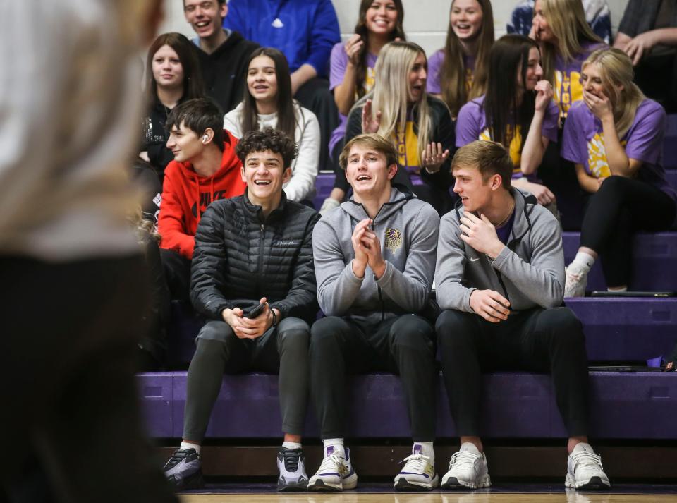 Friends and teammates Jack Reddick, left, Travis Perry, center, and Brady Shoulders, right, attend a pep rally for their basketball team which is playing in the 2023 Sweet 16. Perry, a junior guard for Lyon County High School boys basketball has 4,317 points so far.  He needs 21 points to pass the record of 4,337 set by"King" Kelly Coleman set in 1956. March 14, 2023.