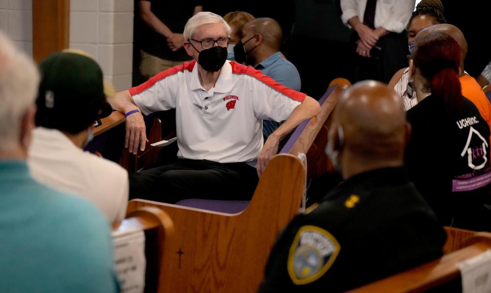 Gov. Tony Evers gathers with others at New Hope Missionary Baptist Church before heading out to walk the neighborhood from the church on West Roosevelt Drive in Milwaukee.