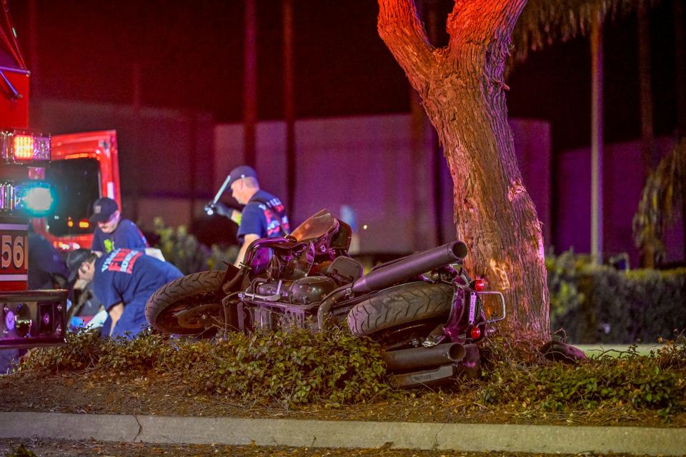 Visalia Police and Fire work to revive the driver involved in motorcycle collision Thursday, August 17, 2023 just after 11 p.m. on Ben Maddox Way between Tulare and Noble avenues. A 43-year-old male was going south when the motorcycle left the roadway and collided with at two trees in the median before he was ejected. Officers, first on scene, and then paramedics attempted life-saving measures but the man died at the scene.