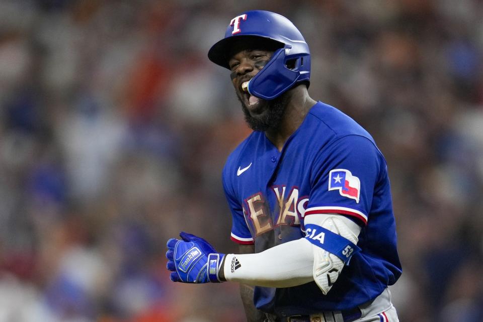 Texas Rangers' Adolis Garcia reacts after hitting a home run during the third inning of Game 6 of the baseball AL Championship Series against the Houston Astros Monday, Oct. 23, 2023, in Houston. (AP Photo/Godofredo A. Vásquez)