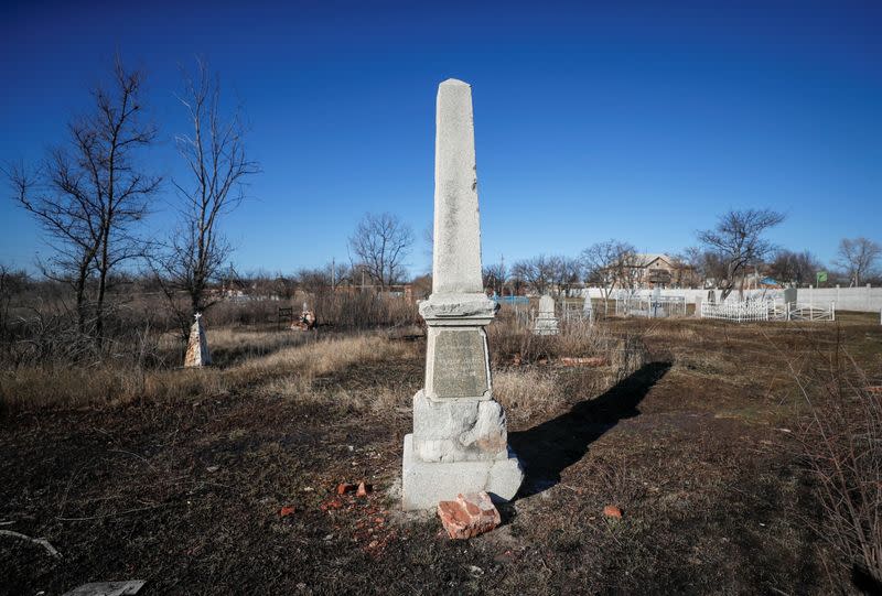 A view shows a gravestone at an old cemetery in the town of Novhorodske