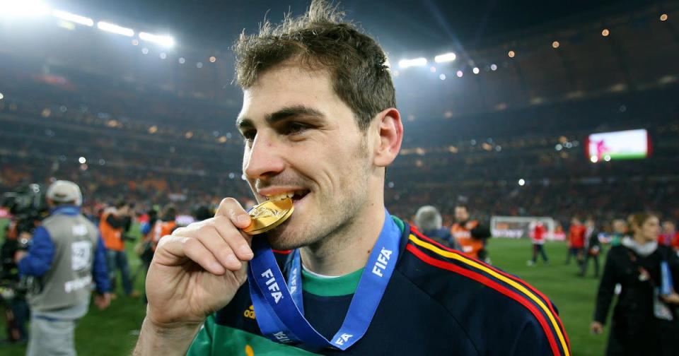 Spain's Iker Casillas bites his World Cup-winners medal. Soccer City, Johannesburg, July 2010. Credit: PA Images
