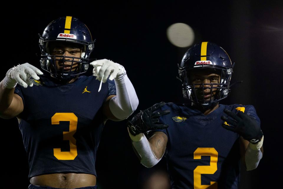 Naples' Devin Moore (3) and Naples' Jonas Duclona (2) pose for a portrait during the de facto Florida 6A District 14 championship between South Fort Myers and Naples, Friday, Oct. 22, 2021, at Naples High School in Naples, Fla.Naples defeated South Fort Myers 51-19.